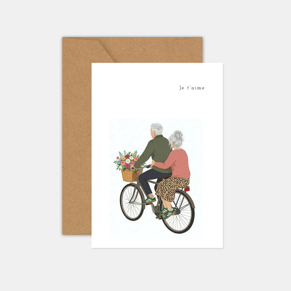 Couple card on a bicycle