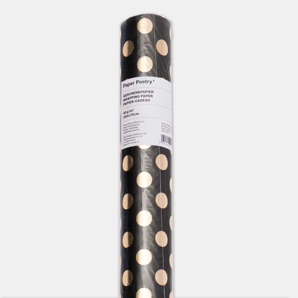Schwarzes Geschenkpapier mit goldenen Punkten